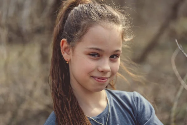 Portrait of a girl in casual clothes in park