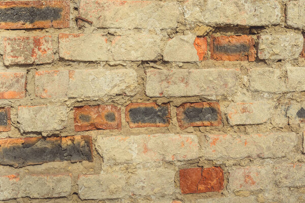 Rough aged masonry backgroundBackdrop of old red bricks with shabby texture