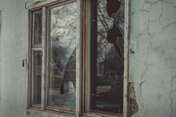Old window on an abandoned old building. 