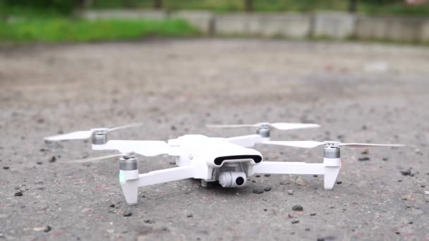 Drone takes off on the street, close-up. — Stock Video