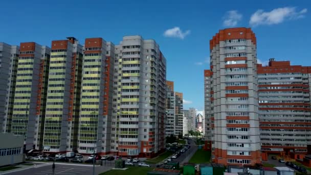 Modern apartment buildings on a sunny day with a blue sky. Facade of a modern apartment building. residential building modern apartment condominium architecture — Stock Video
