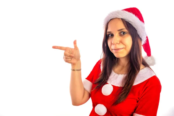 Lachende mooie jonge vrouw in Santa Claus pak is op zoek naar camera op een witte achtergrond. Vrolijk Kerstfeest en Gelukkig Nieuwjaar. — Stockfoto