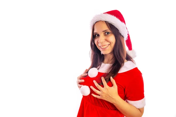Lächelnd blickt die schöne junge Frau im Weihnachtsmannanzug in die Kamera auf weißem Hintergrund. Frohe Weihnachten und ein gutes neues Jahr. — Stockfoto