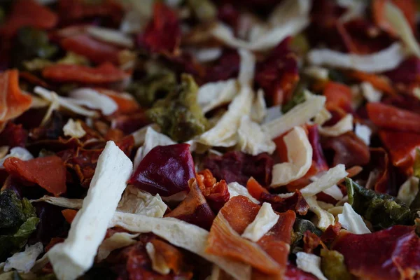 Dried vegetables texture. Texture background. Green spice mix dried vegetables and herbs. Spices consist paprika garlic onion parsnip celery coriander oregano pepper rosemary