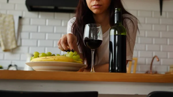 Close Adult Female Takes Glass Wine Sitting Kitchen — Stock Photo, Image