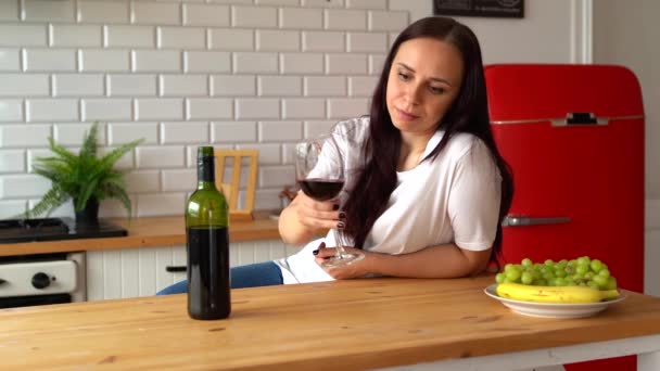 Young Woman Takes Glass Wine Puts Back Takes Bottle Wine — Stock Video