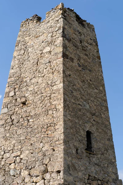 Old stone tower. Ancient stone building of old town.