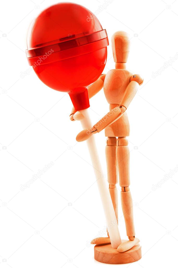 Concept with lollipop, candy on stick and standing wooden toy. Isolated on white background.