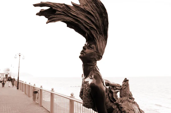 Statue on the promenade in Svetlogoskorke. Goddess of water.