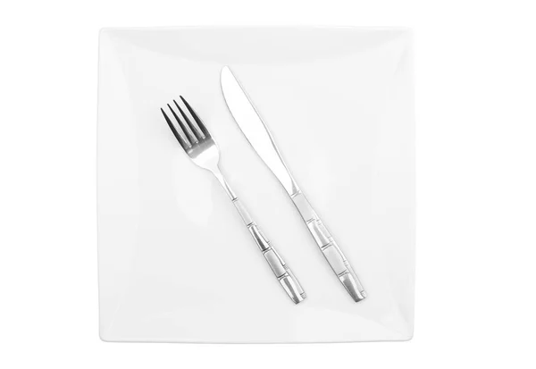 Gabel Und Messer Auf Einem Quadratischen Teller Isoliert — Stockfoto