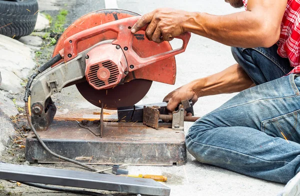 The workers are cutting steel. With steel cutting tools.