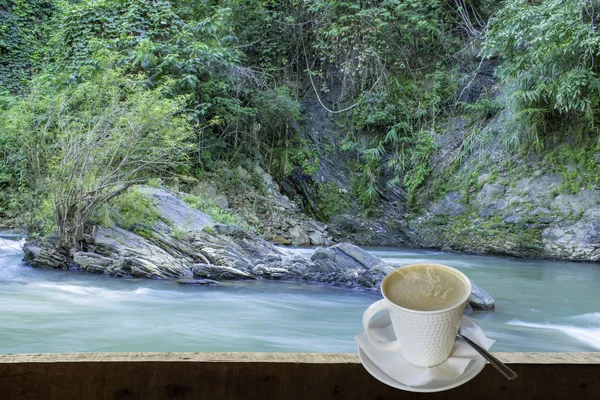 Isolated Hot coffee Put a glass of white with a casual break from work  background waterfall with clipping path.