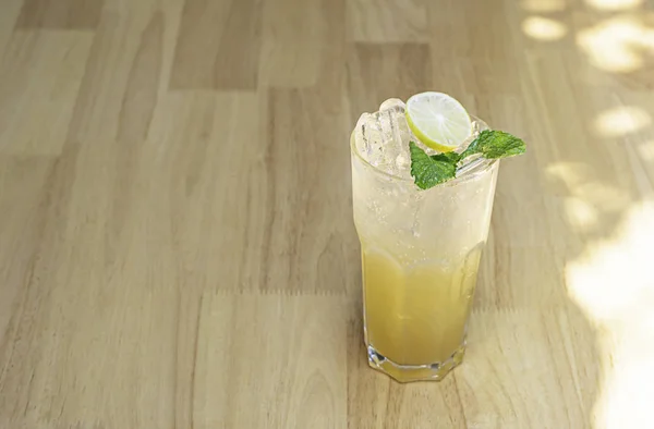 Honey Lemon Soda in glass on the wooden table.