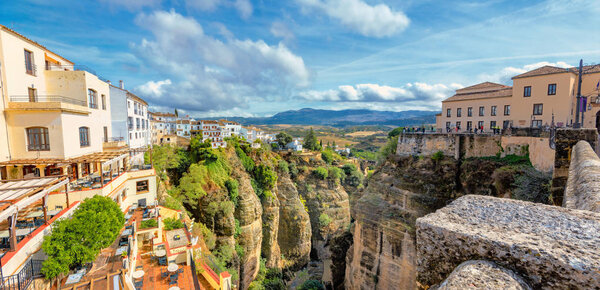 Panoramic cityscape with view of Tajo Gorge in Ronda. Andalusia, Spain   