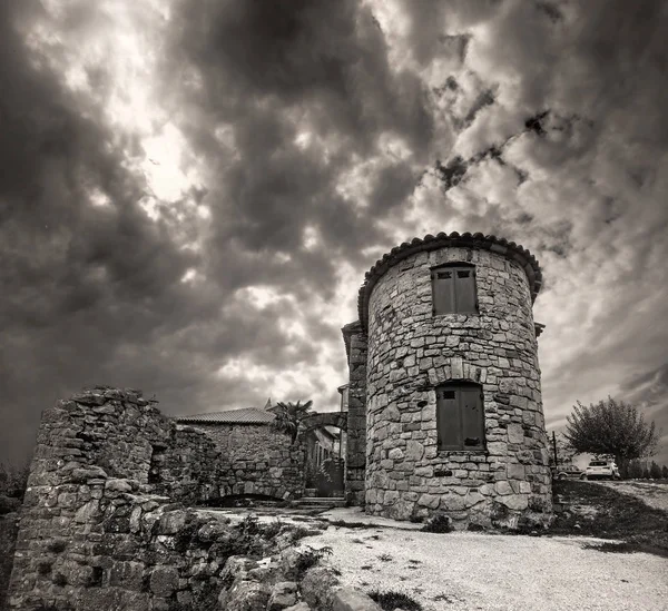 Cityscape of Hum town with small courtyard and old tower. Smallest city in the world. Black and white color. Istria, Croatia