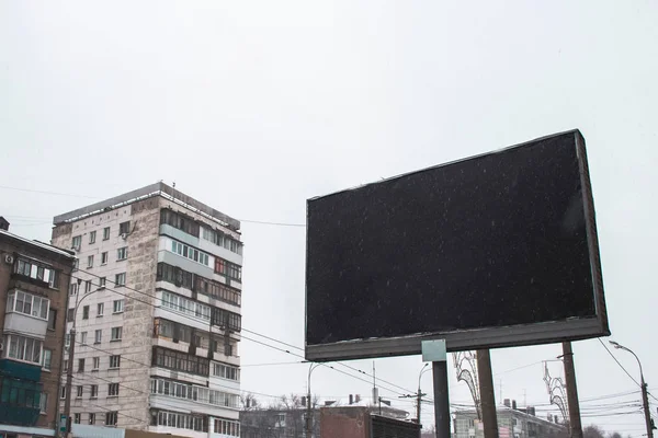 street advertising billboard with advertising space and winter snow day