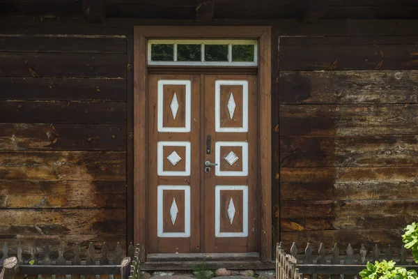 Wooden door in old wooden building in open-air museum in Granica — Stock Photo, Image