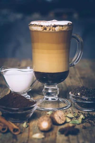 SPICE DIRTY CHAI LATTE. Masala chai and espresso. Autumn or winter warm spice coffee drink. Close up