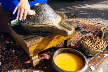 ARGAN OIL. Making of argan oil from argan nuts and seeds in Morocco. Traditional method