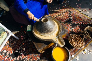 ARGAN OIL. Making of argan oil from argan nuts and seeds in Morocco. Traditional method