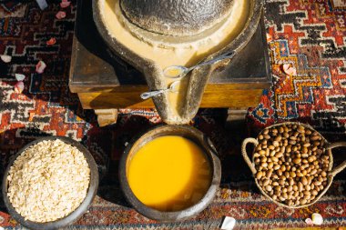 ARGAN OIL. Making of argan oil from argan nuts and seeds in Morocco. Traditional method