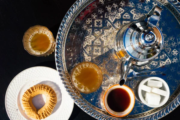 Arabian Mint Tea (Moroccan Mint Tea) The national hot drink in the Middle East and the Muslim world. Served in a special iron silver teapot with sugar.
