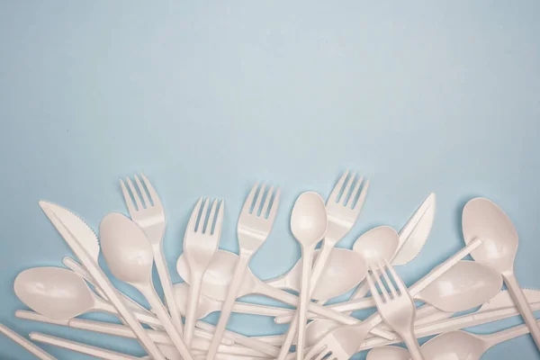 Single-use plastic products: forks, cutlery, plastic cups on min