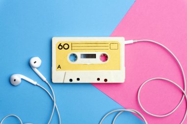 Retro old school 80-s or 90-s concept. Audio cassette on a brigh clipart