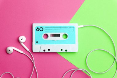 Retro old school 80-s or 90-s concept. Audio cassette on a brigh clipart