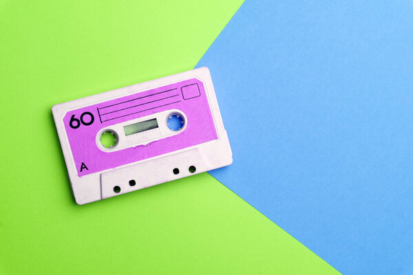 Retro old school 80-s or 90-s concept. Audio cassette on a brigh