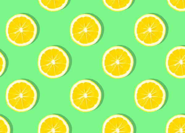 Fresh lemon (lemons) pattern on pink background. Minimal concept