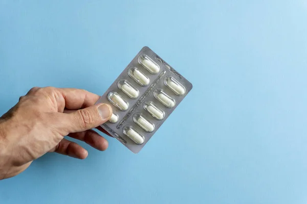 Packs of pills (drugs) on a colored background. Minimal concept. — Stock Photo, Image