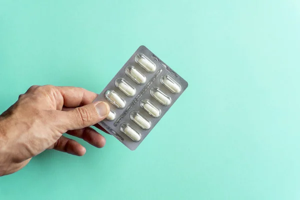 Packs of pills (drugs) on a colored background. Minimal concept. — Stock Photo, Image