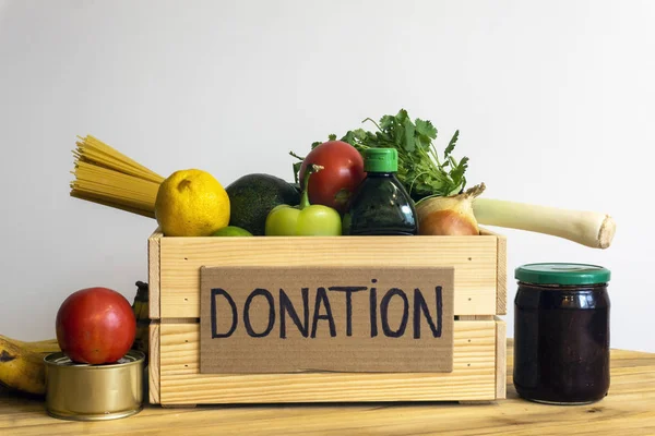 Food donation concept. Donation box with vegetables, fruits and