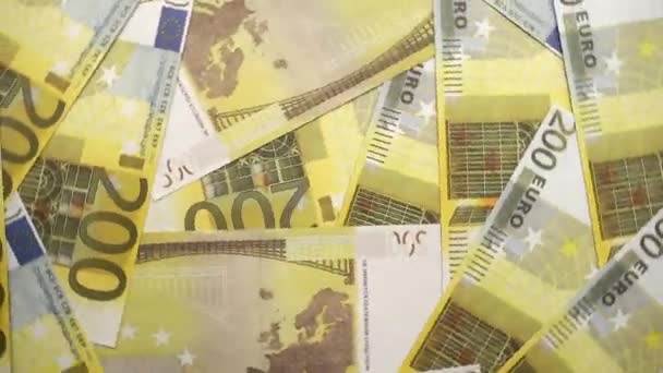 背景を回転させる 200ユーロ紙幣の背景 ビジネス 所得の概念 — ストック動画