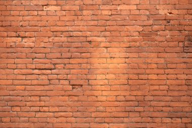Old brick wall. Brickwork from an old brick in a rustic style. The structure and pattern of the destroyed stone wall. Copy space.	
