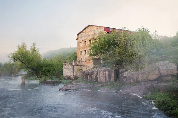 The house is thrown down by the river. Walking in the outdoors. The beauty of the nature of Cherkassy region. Travel to Ukraine. Morning in the village of Buki. River South Boog. April. Spring.