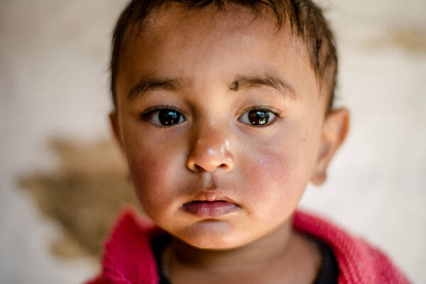 Kullu, Himachal Pradesh, India - April 01, 2019 : Portrait of Himalayan boy, Kid in himalayas