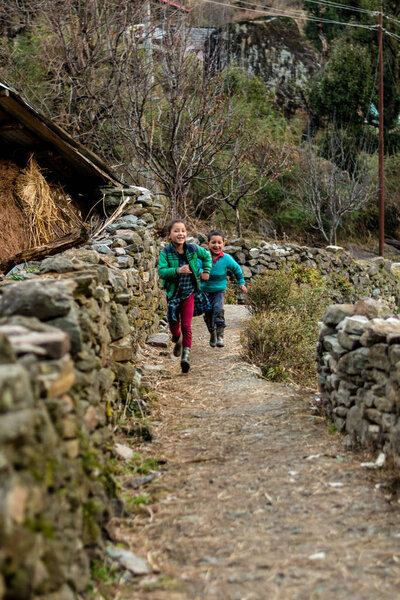 Kullu, Himachal Pradesh, India - February 04, 2019 : Photo of himalayan kid running in Himalayas