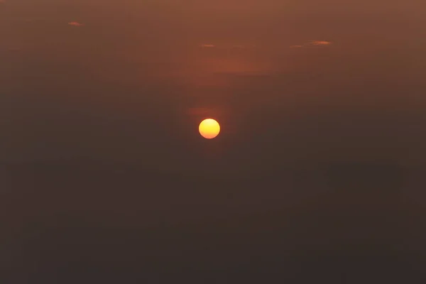 background with sun and magic dense cover farm fog at the sunrise