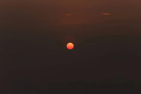 background with sun and magic dense cover farm fog at the sunrise