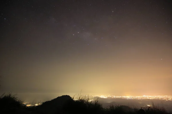 The magic galaxy or milky way on the night sky with mountain peek foreground