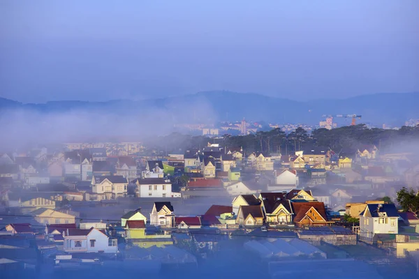 beautiful fog cover village in valley with colorful houses as islands in the mist