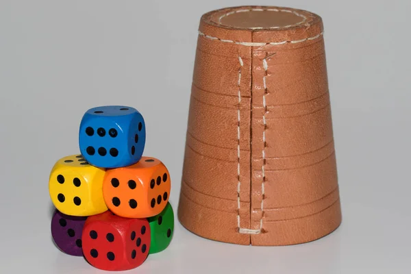 colorful cubes stacked in front of the leather cubes mug in totalview photographed in macro and close as a cut out