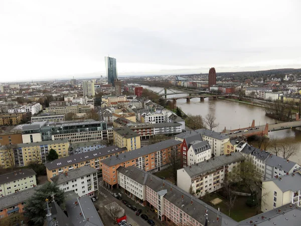 wide angle view on the river in frankfurt am main and the buildings around photographed during a sightseeing tour from the steeple in frankfurt am main with wide angle lens