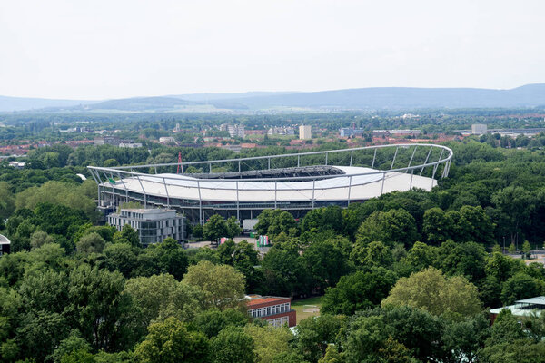 closer view from the tower of the new civil hall on the arena  and the tree area in hannover germany photographed during a walk at a cloudy sunny day