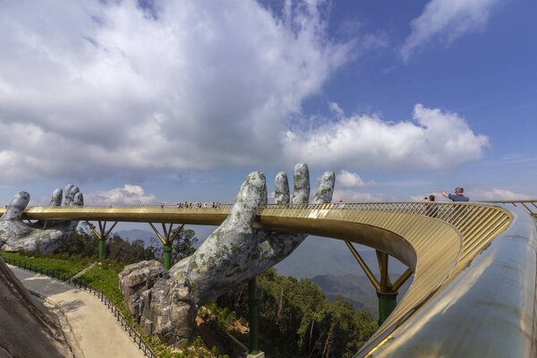 Da Nang, Vietnam - October 31, 2018 Golden Bridge known as Hands of God, a pedestrian footpath lifted by two giant hands, open in July 2018 at Ba Na Hills in Da Nang, Vietnam.