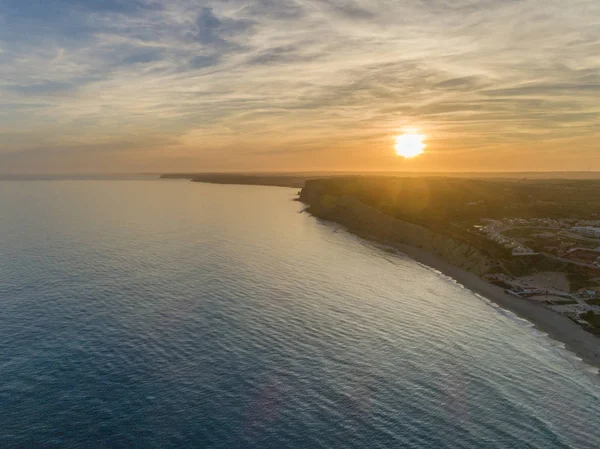 Aerial sunset seascape, of Praia Porto de Mos (Beach and seaside cliff formations along coastline of Lagos city), famous destination in Algarve. South Portugal. — Stock Photo, Image