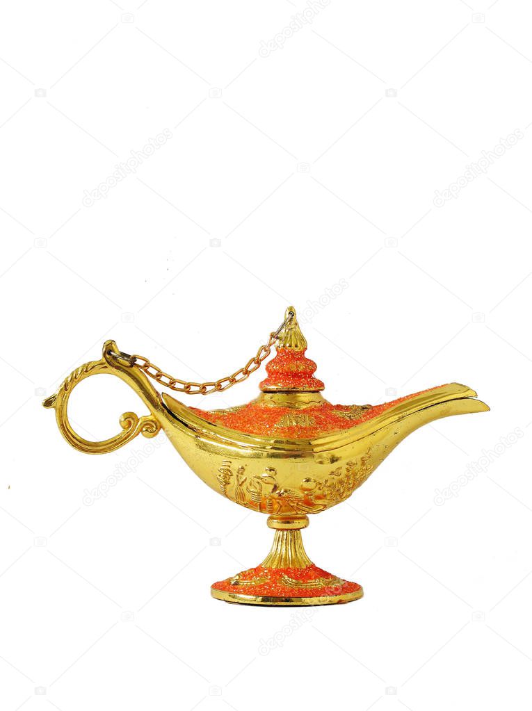 Ginie Wish Lamp gold and red in color with a white background