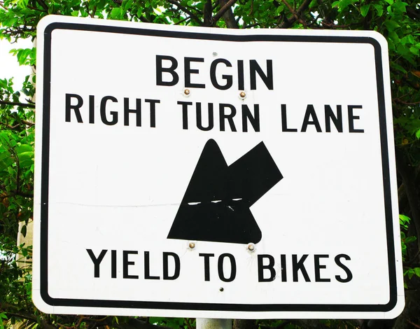 Begin Right Turn Lane Yield to Bikes Metal Sign